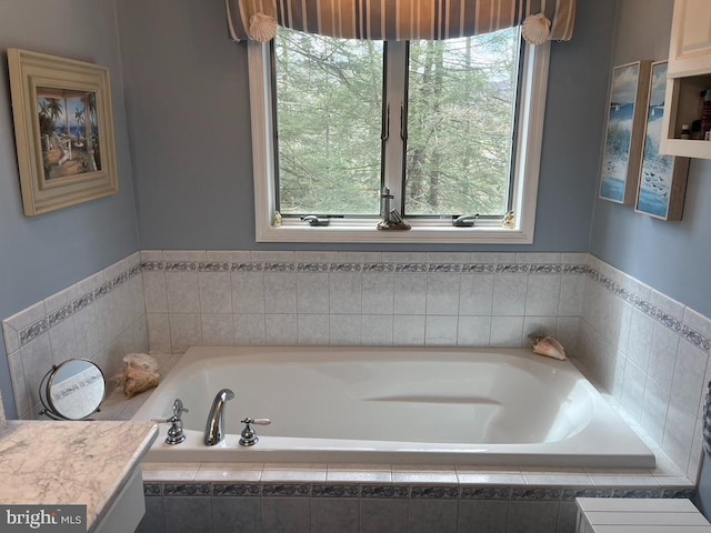 bathroom featuring plenty of natural light and a garden tub