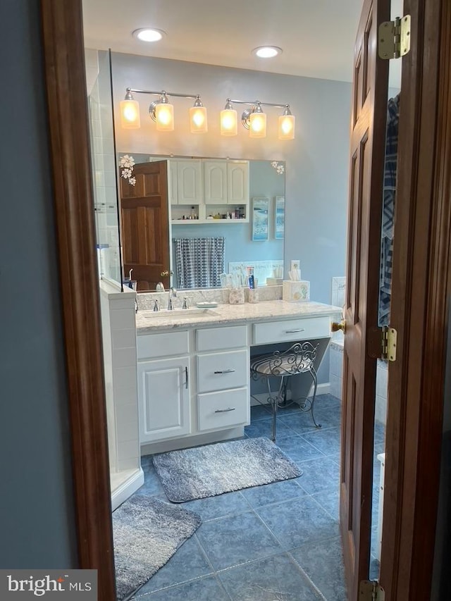 bathroom featuring vanity, recessed lighting, and tile patterned floors