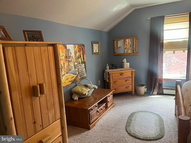 bedroom with vaulted ceiling and carpet flooring