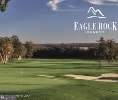 view of home's community featuring golf course view