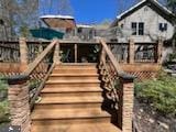 exterior space featuring stairs and a deck