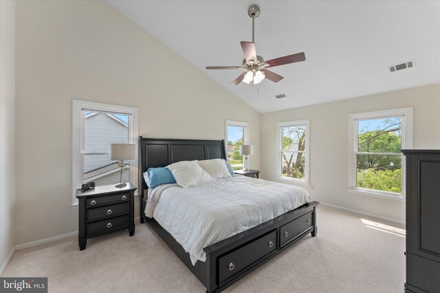 bedroom with visible vents, light colored carpet, and baseboards