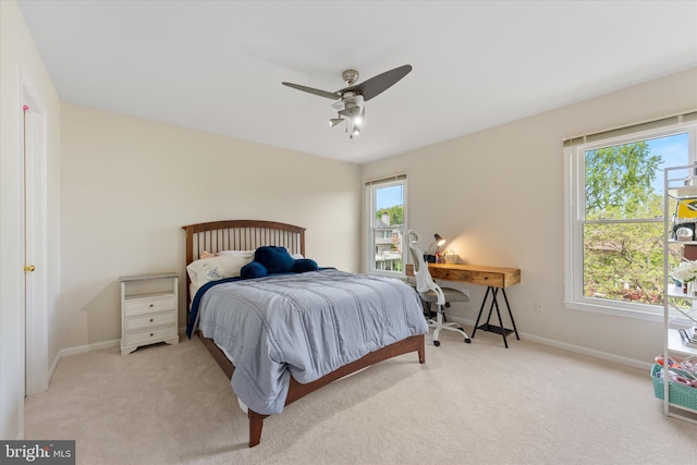 bedroom with baseboards, ceiling fan, and carpet flooring