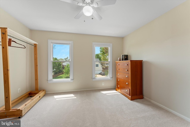 unfurnished bedroom with baseboards, ceiling fan, and carpet floors