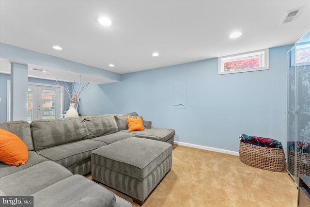 living area featuring recessed lighting, visible vents, baseboards, light colored carpet, and french doors