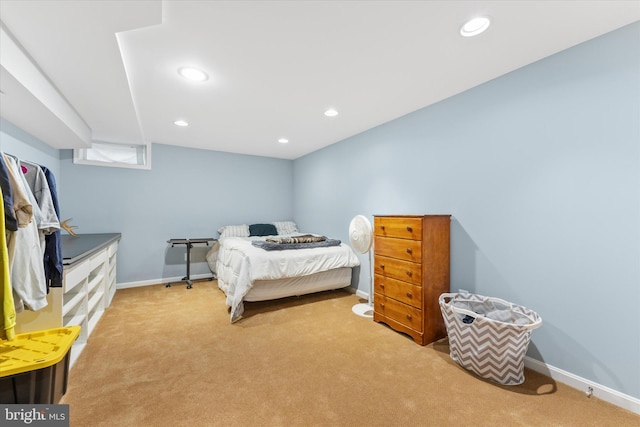 carpeted bedroom featuring baseboards and recessed lighting