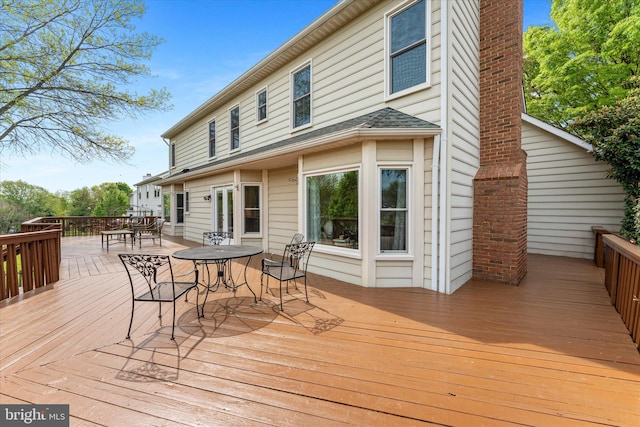 deck featuring outdoor dining area