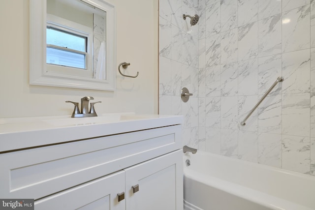 full bath featuring vanity and bathtub / shower combination