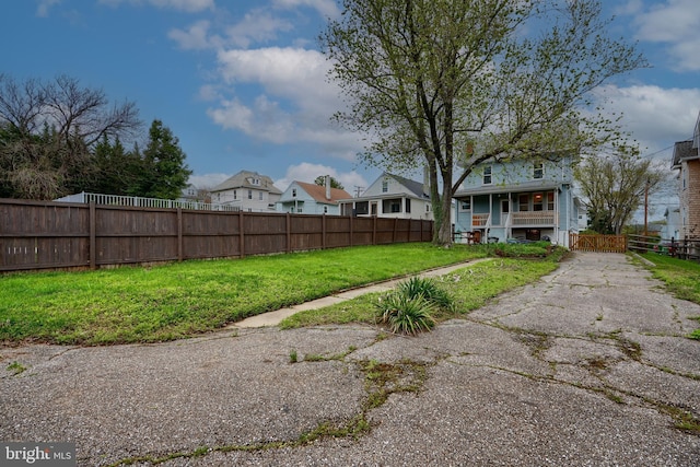 view of yard with a residential view and fence private yard