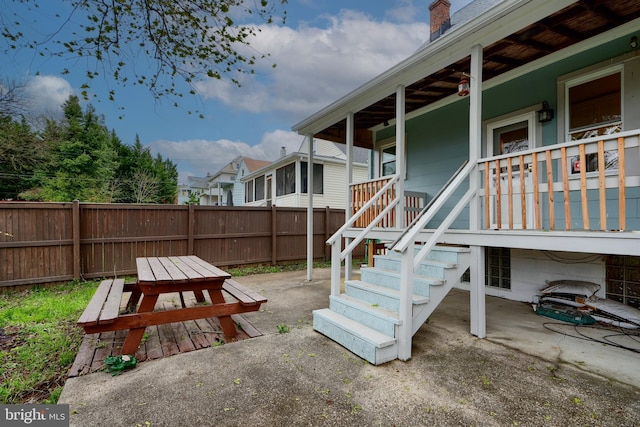 view of patio / terrace with fence private yard and covered porch