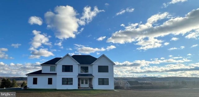 view of front of property with french doors and a front yard
