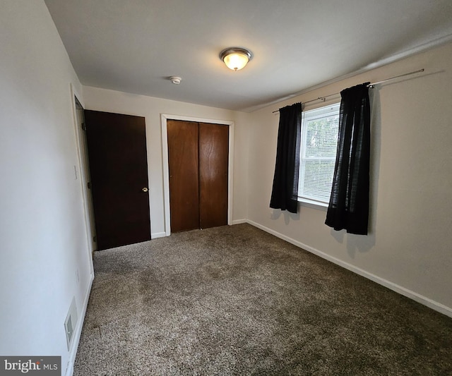 4471/2 Cook Ave, Paulsboro, NJ 08066 - unfurnished bedroom with visible vents, a closet, baseboards, and carpet floors