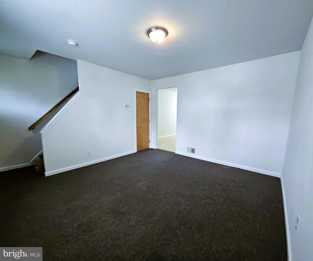 4471/2 Cook Ave, Paulsboro, NJ 08066 - spare room with dark colored carpet, baseboards, visible vents, and stairs