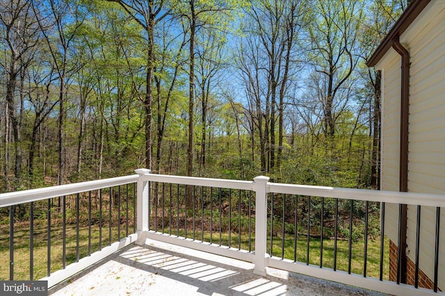 deck featuring a wooded view