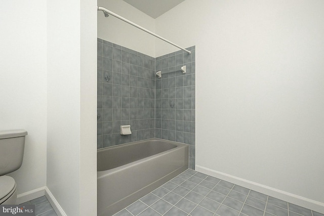 full bathroom with bathtub / shower combination, tile patterned flooring, baseboards, and toilet
