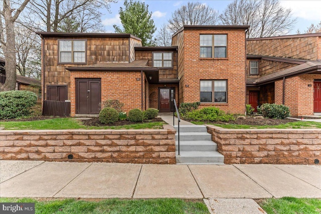 view of front of property featuring brick siding