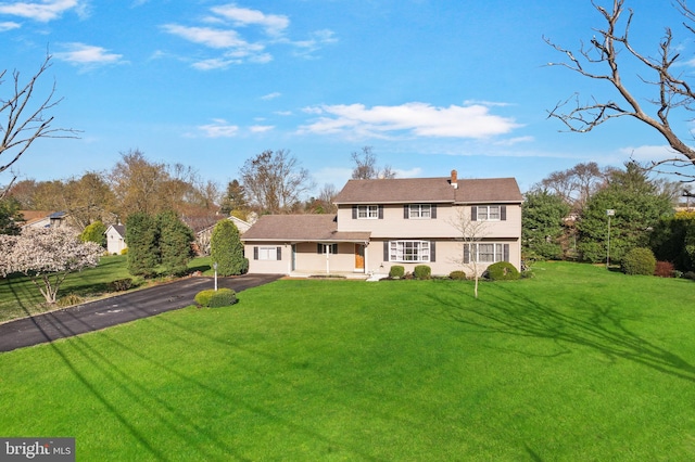 428 Dutch Neck Rd, East Windsor, NJ 08520 - rear view of house featuring aphalt driveway and a yard