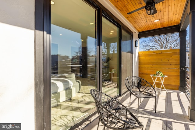 balcony featuring a ceiling fan
