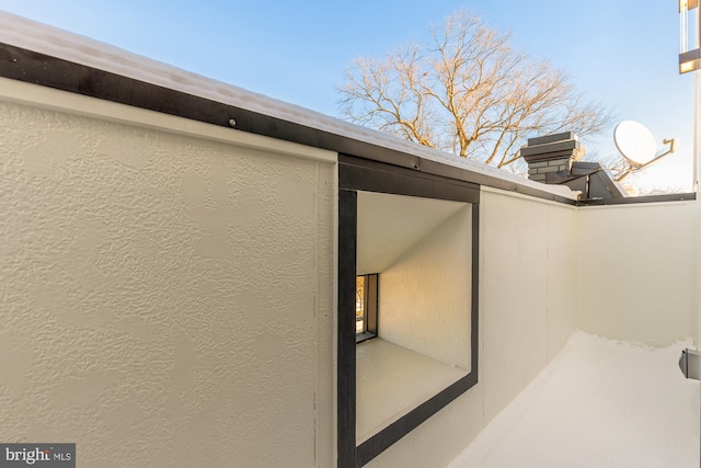 exterior details featuring stucco siding