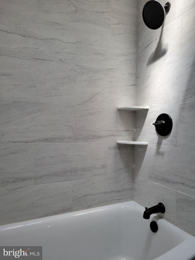 full bathroom with shower / washtub combination
