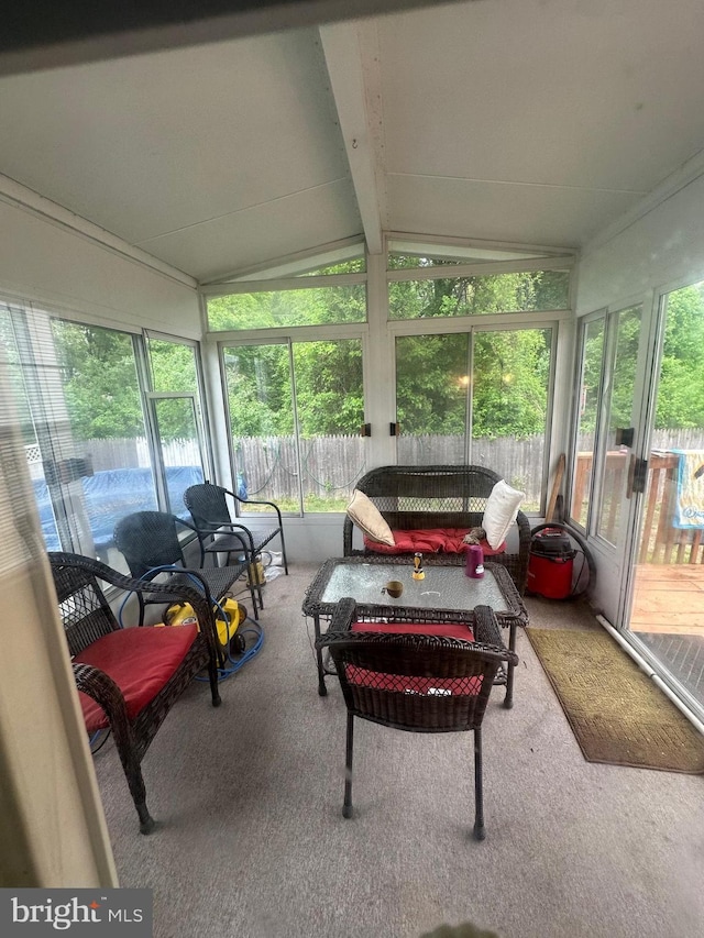 sunroom featuring plenty of natural light and an outdoor hangout area