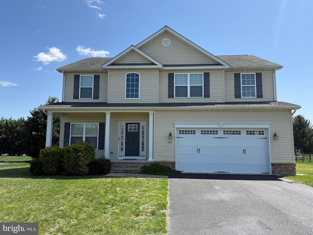 97 S Nightingale Dr, Milford, DE 19963 - view of front of home with a garage, driveway, and a front lawn