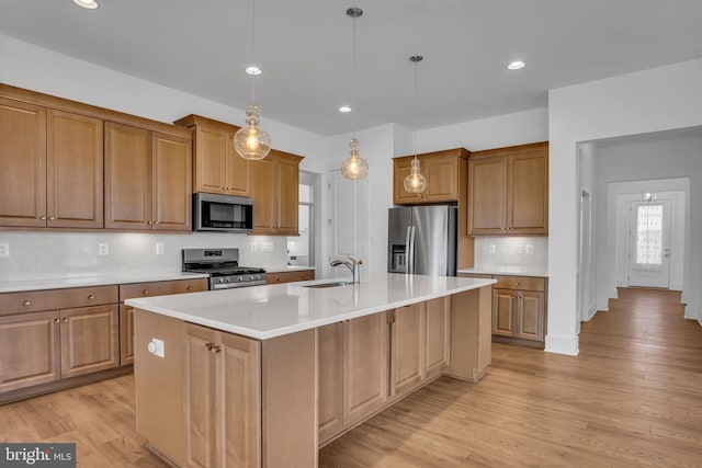 85 Quiet Creek Dr, Gettysburg, PA 17325 - kitchen featuring tasteful backsplash, recessed lighting, stainless steel appliances, a center island with sink, and light wood finished floors