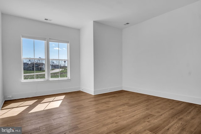 85 Quiet Creek Dr, Gettysburg, PA 17325 - empty room featuring visible vents, baseboards, and wood finished floors