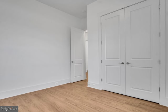 85 Quiet Creek Dr, Gettysburg, PA 17325 - unfurnished bedroom with a closet, baseboards, and light wood-style floors