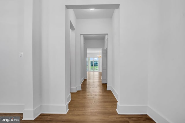 85 Quiet Creek Dr, Gettysburg, PA 17325 - hall featuring wood finished floors, an inviting chandelier, and baseboards