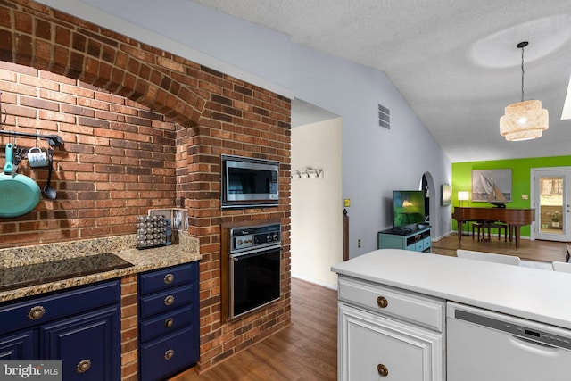 2200 Harpoon Dr, Stafford, VA 22554 - kitchen with black appliances, blue cabinetry, dark wood-type flooring, lofted ceiling, and open floor plan