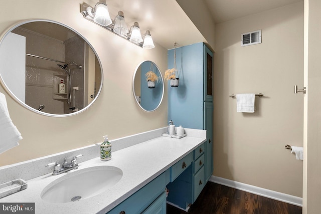 2200 Harpoon Dr, Stafford, VA 22554 - full bath with vanity, wood finished floors, and baseboards