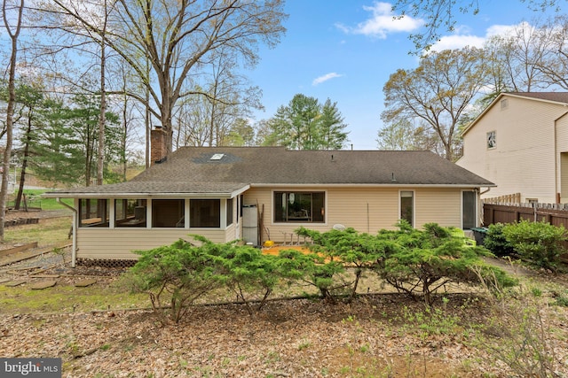 2200 Harpoon Dr, Stafford, VA 22554 - back of house with a sunroom, a chimney, and roof with shingles