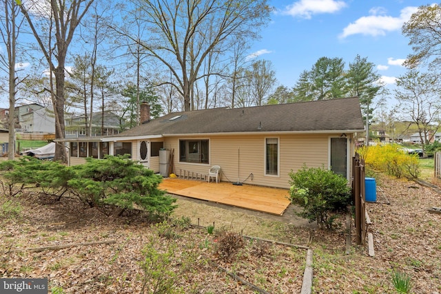 2200 Harpoon Dr, Stafford, VA 22554 - rear view of property featuring a wooden deck, a sunroom, and a chimney