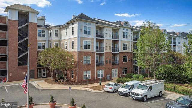 3830 Lightfoot St Unit 335, Chantilly, VA 20151 - view of building exterior with a residential view and uncovered parking