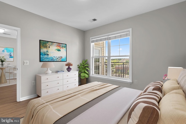 3830 Lightfoot St Unit 335, Chantilly, VA 20151 - bedroom featuring baseboards, wood finished floors, and visible vents