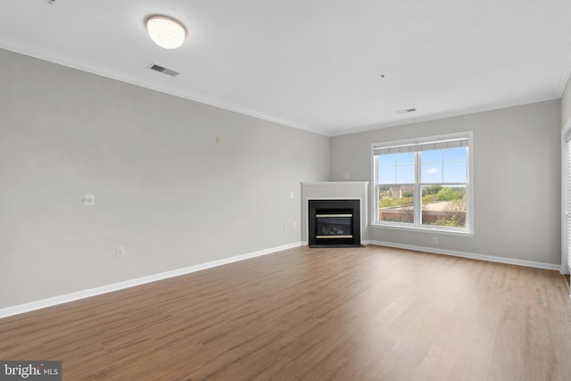 3830 Lightfoot St Unit 335, Chantilly, VA 20151 - unfurnished living room featuring baseboards, a fireplace with flush hearth, wood finished floors, and ornamental molding