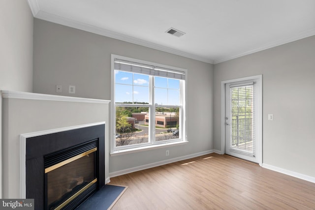 3830 Lightfoot St Unit 335, Chantilly, VA 20151 - unfurnished living room with crown molding, baseboards, visible vents, and wood finished floors