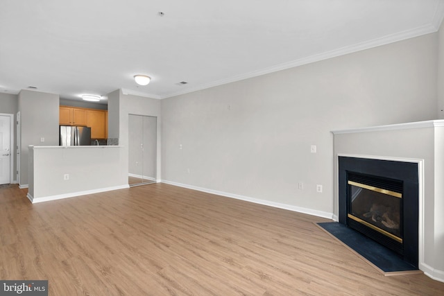 3830 Lightfoot St Unit 335, Chantilly, VA 20151 - unfurnished living room featuring light wood-style floors, ornamental molding, baseboards, and a fireplace with flush hearth
