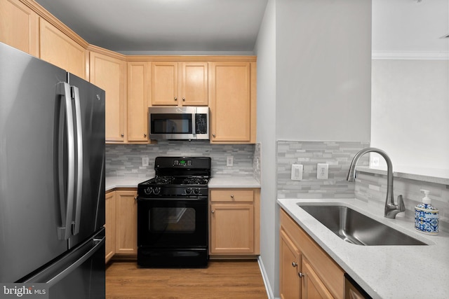 3830 Lightfoot St Unit 335, Chantilly, VA 20151 - kitchen featuring a sink, freestanding refrigerator, stainless steel microwave, tasteful backsplash, and black gas range