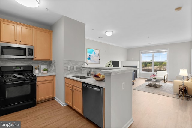 3830 Lightfoot St Unit 335, Chantilly, VA 20151 - kitchen with appliances with stainless steel finishes, tasteful backsplash, light wood-type flooring, a sink, and open floor plan