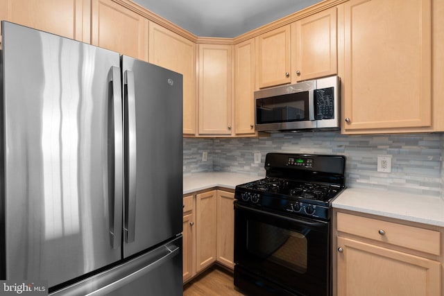 3830 Lightfoot St Unit 335, Chantilly, VA 20151 - kitchen with light countertops, decorative backsplash, appliances with stainless steel finishes, and light brown cabinetry