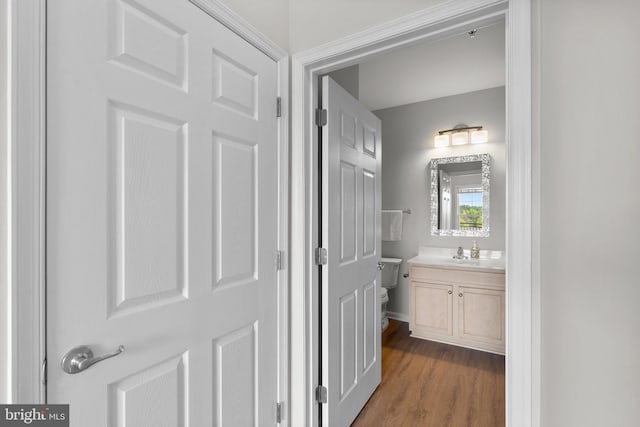 3830 Lightfoot St Unit 335, Chantilly, VA 20151 - half bathroom with vanity, toilet, and wood finished floors