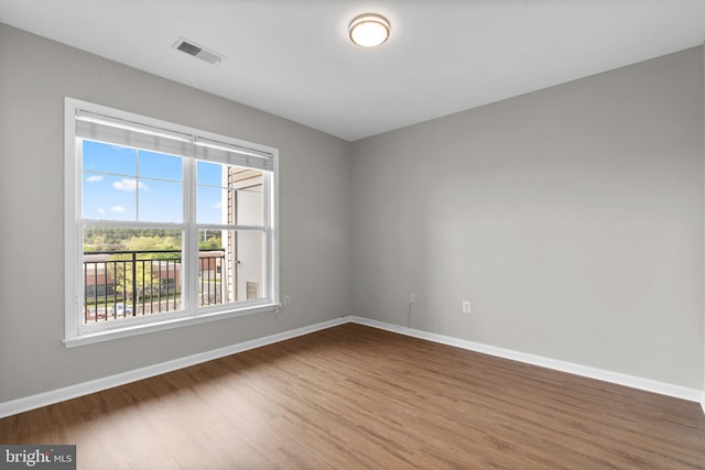 3830 Lightfoot St Unit 335, Chantilly, VA 20151 - spare room featuring baseboards, wood finished floors, and visible vents