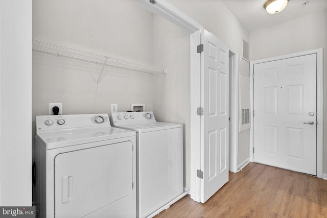 3830 Lightfoot St Unit 335, Chantilly, VA 20151 - washroom with washing machine and clothes dryer, laundry area, visible vents, and light wood-type flooring