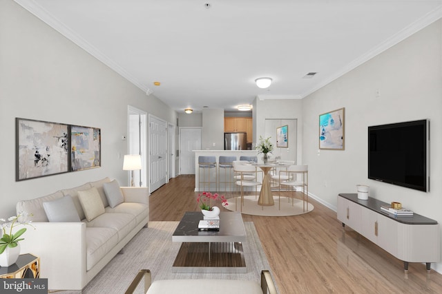 3830 Lightfoot St Unit 335, Chantilly, VA 20151 - living area featuring baseboards, visible vents, ornamental molding, and light wood-style floors