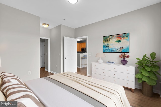 3830 Lightfoot St Unit 335, Chantilly, VA 20151 - bedroom featuring baseboards and wood finished floors