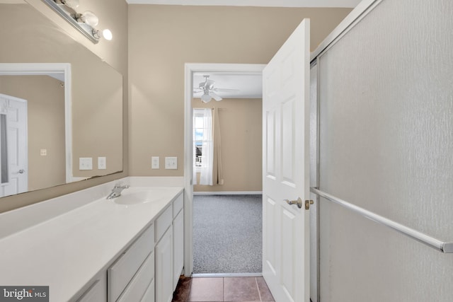 bathroom featuring vanity, a ceiling fan, and tile patterned floors