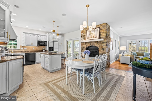dining space featuring light tile patterned flooring, baseboards, ornamental molding, and recessed lighting