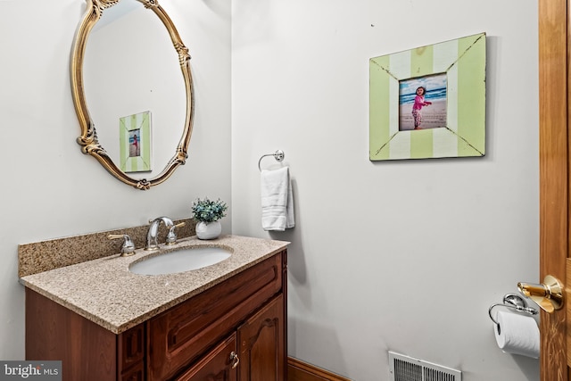 bathroom featuring visible vents and vanity